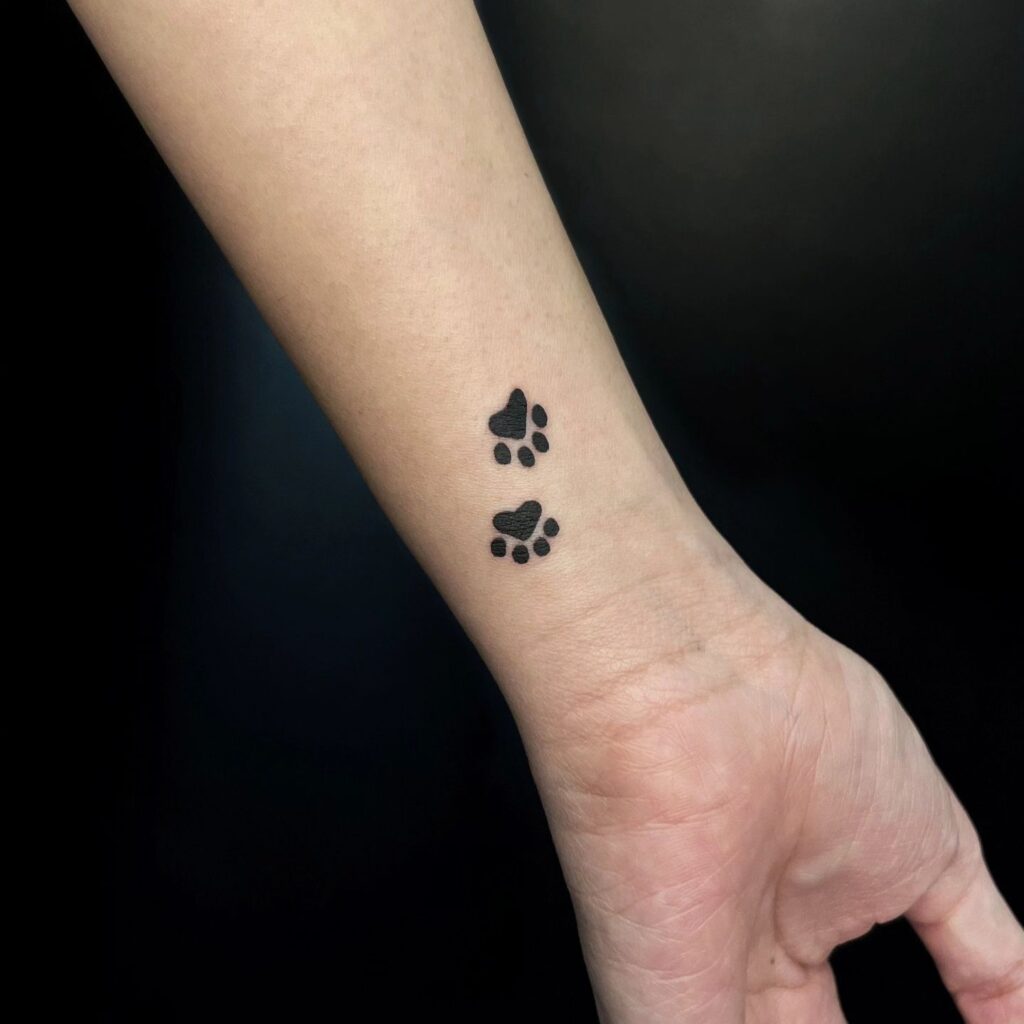 Two Small Dog Paw Prints on the Inner Wrist: Dual Paw Adornment
