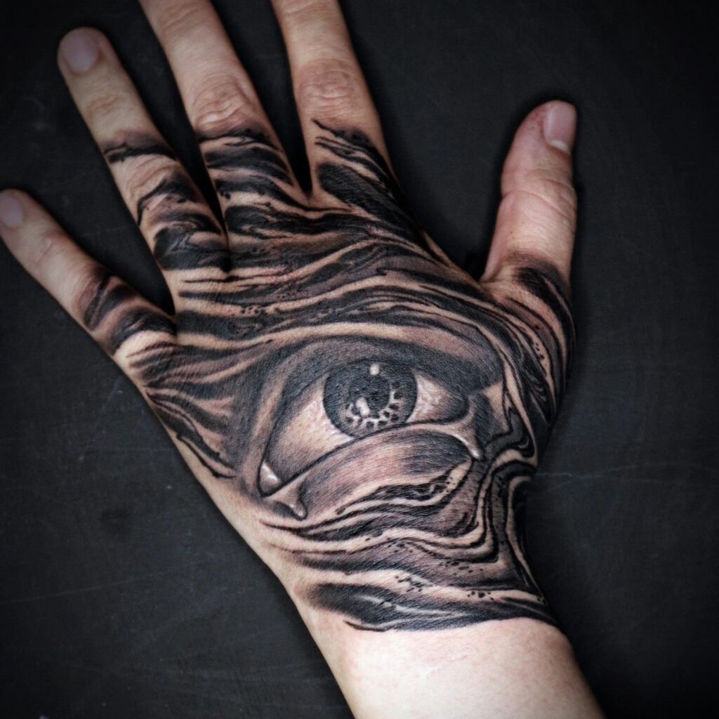 Unique Bold Black Eye Tattoo Design For Hand with image