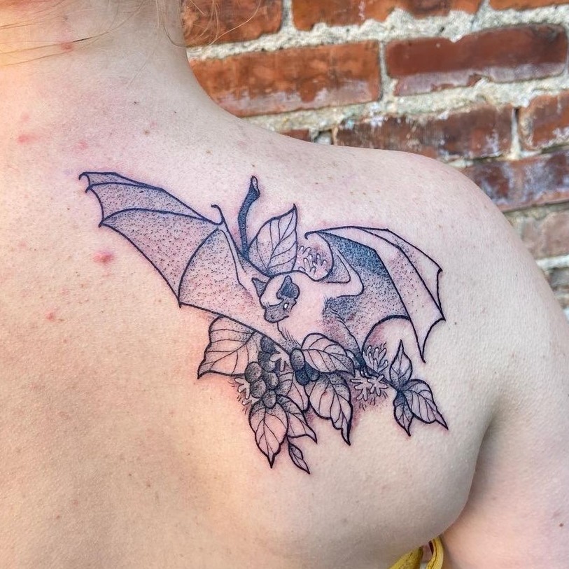Unique Coffee plant tattoo with bat on the back with image