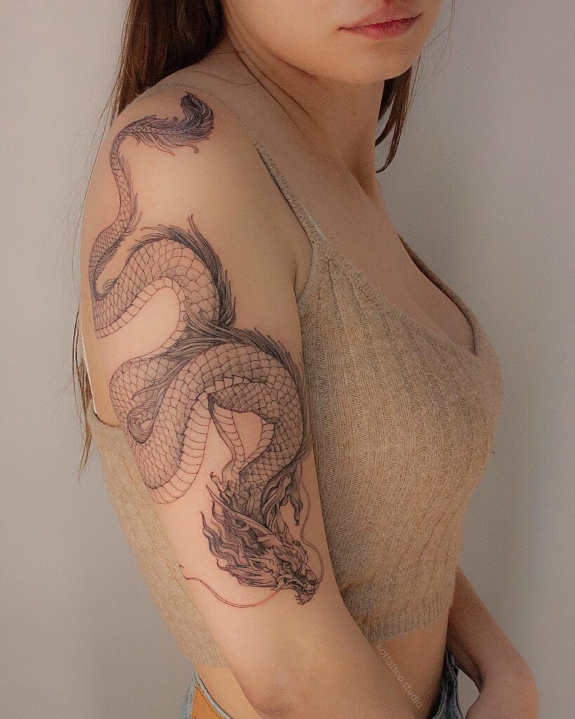 Unique Dragon Arm Sleeve Tattoo for Females Mythical Elegance image