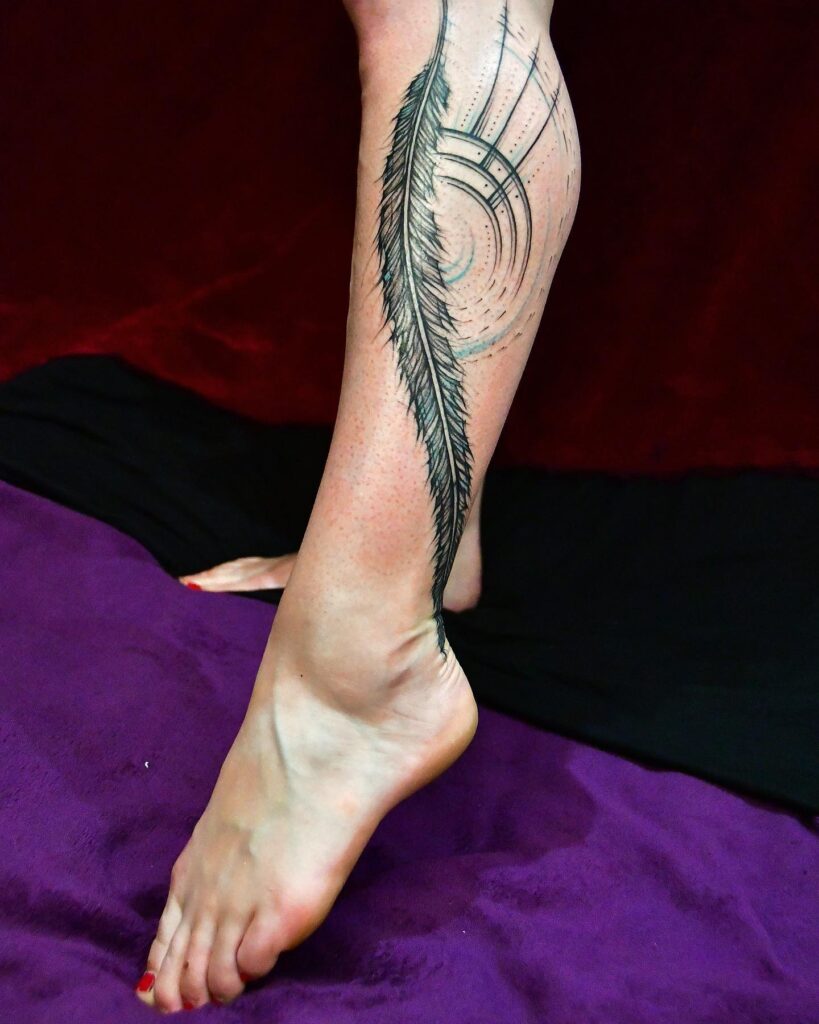 Unique Feather on leg tattoo design for women with image