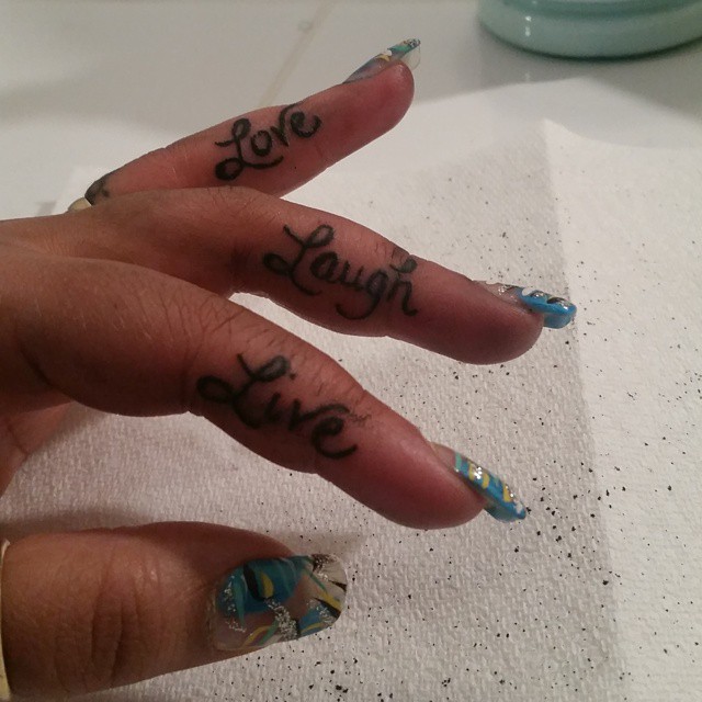 Unique Female Live Love Laugh Tattoo on Fingers