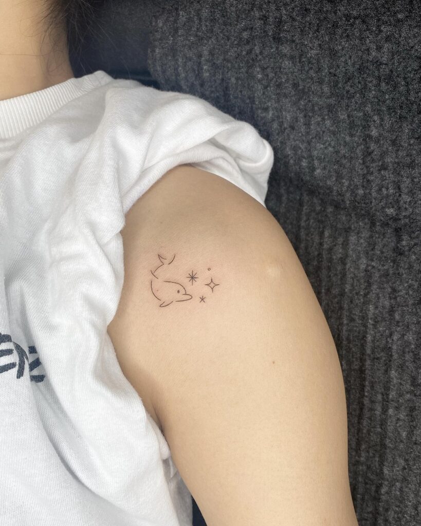 Unique dolphin star tattoo on shoulder for girls