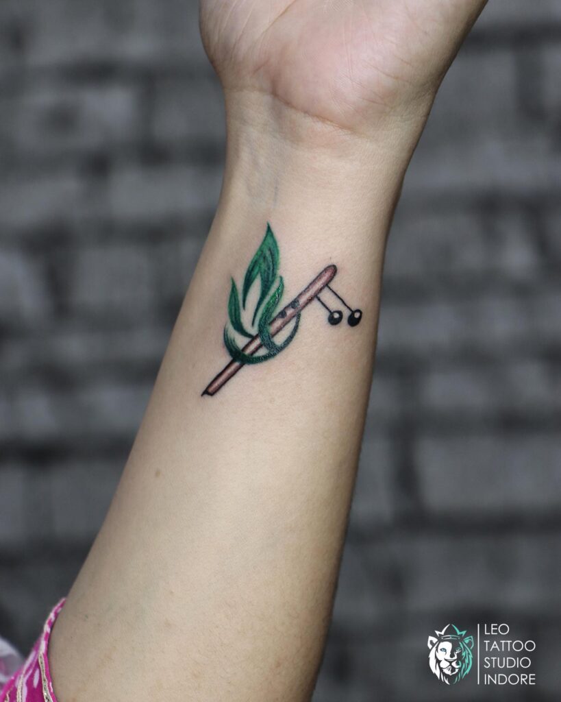 Unique Inner Wrist Peacock Feather and Flute Tattoo for Women : Exquisite and Symbolic