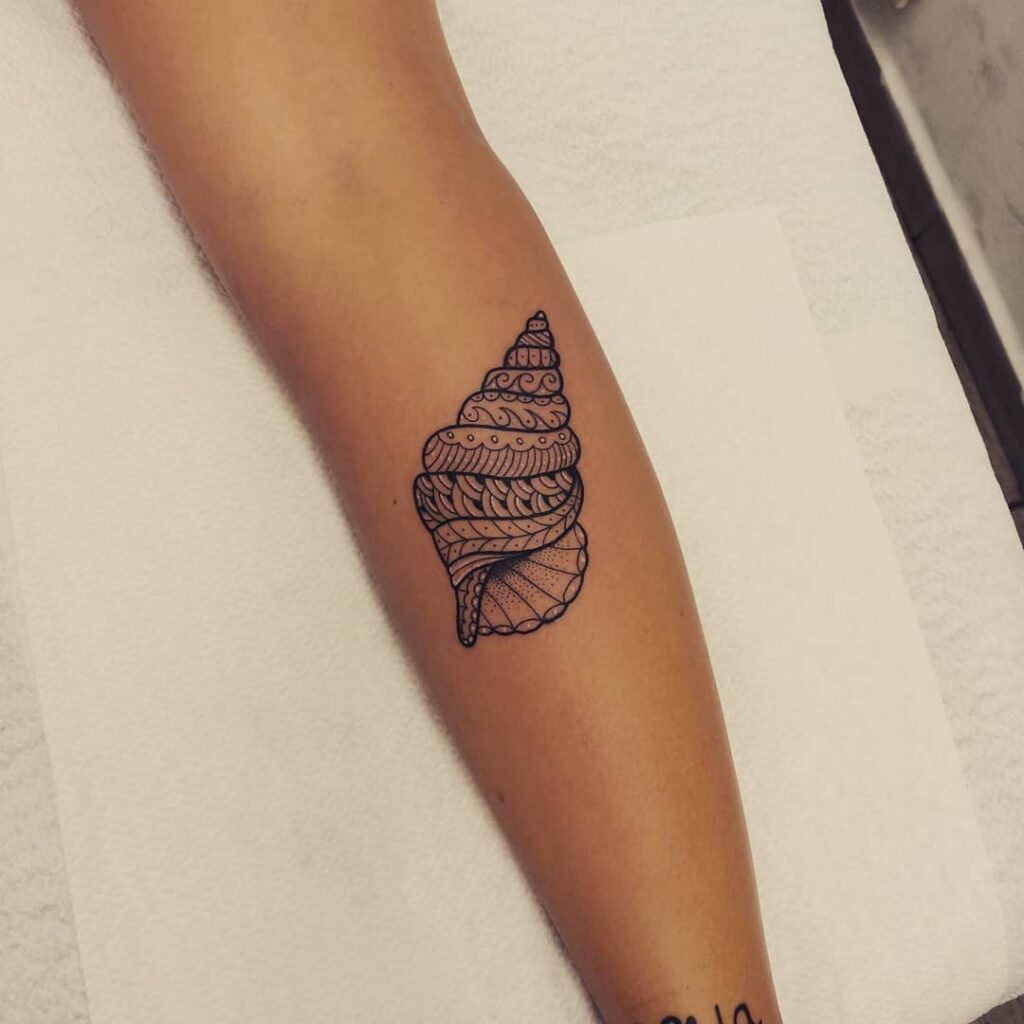 Unique shell tattoo leg for female calf