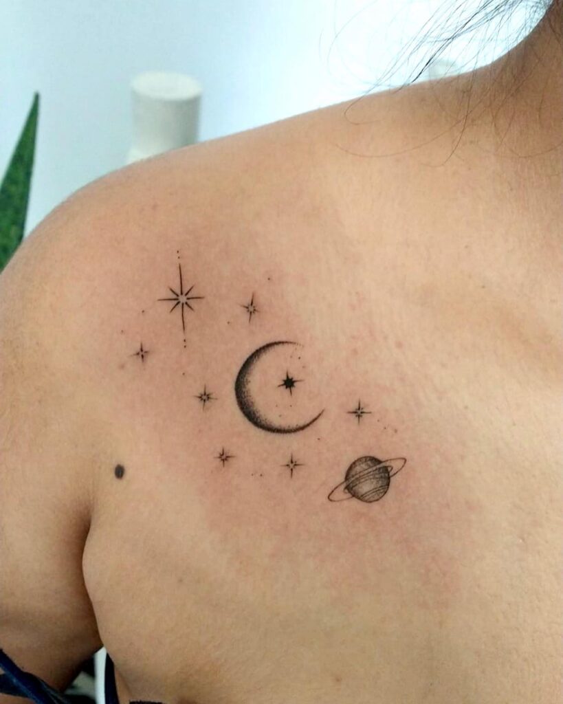 Universe star moon tattoo on female shoulder