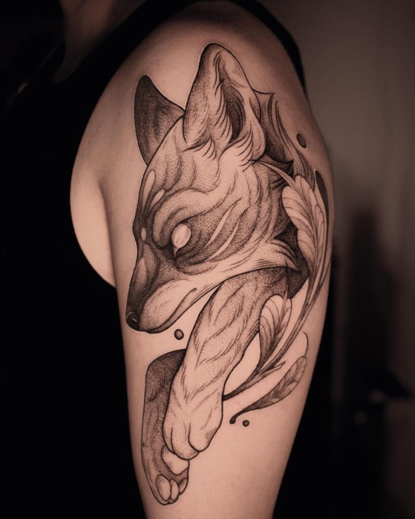 Upper arm fox tattoo bold black design