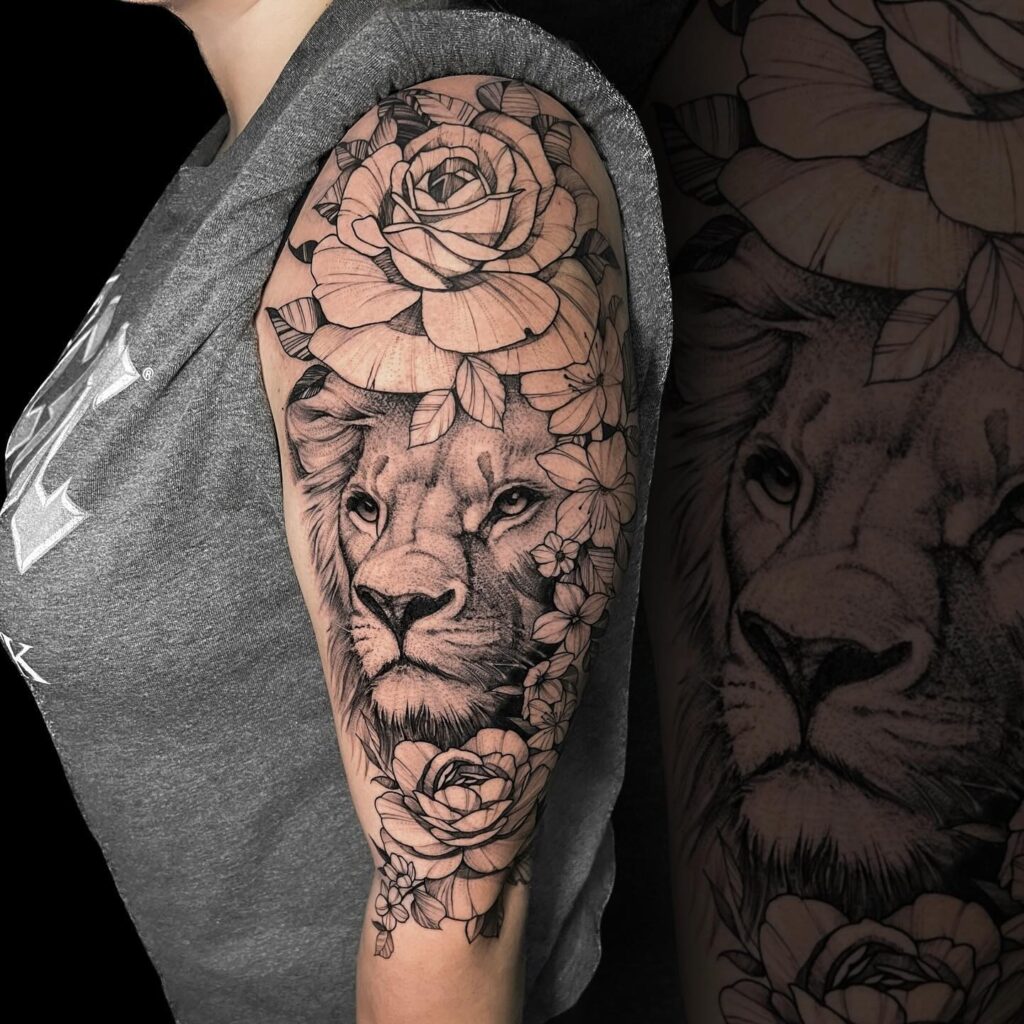 Upper arm fully covered lion with flowers tattoo for women: floral pride