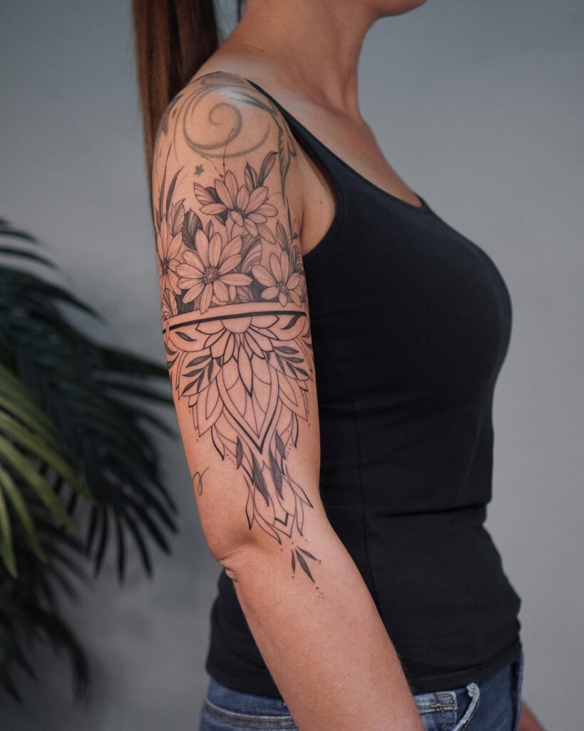 Upper half sleeve fineline flowers and mandala tattoo