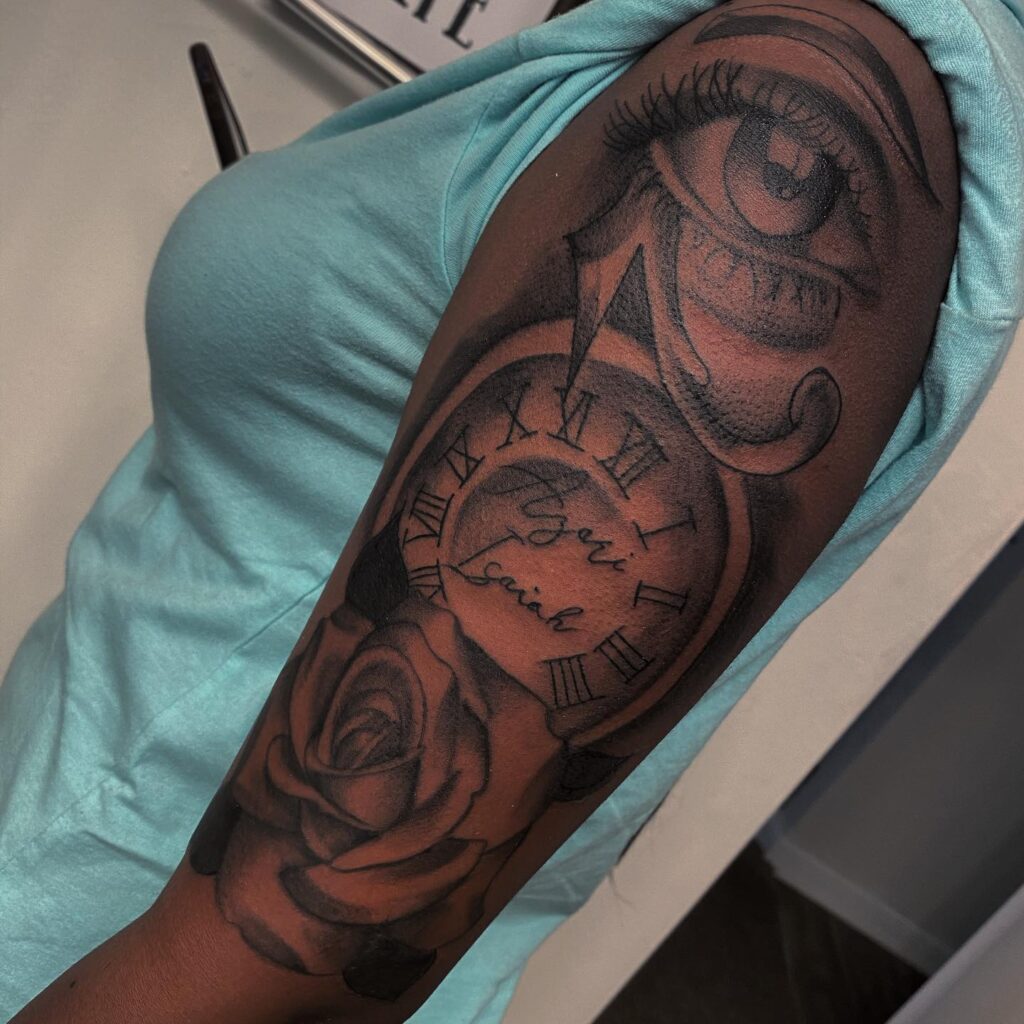 Upper women's half sleeve rose, eye, and clock tattoo