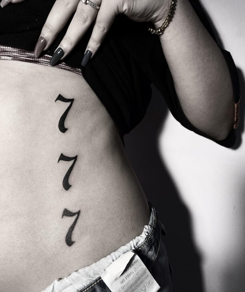 Vertical 777 Rib Tattoo in Bold Font for a Striking Look: Sequential Harmony 