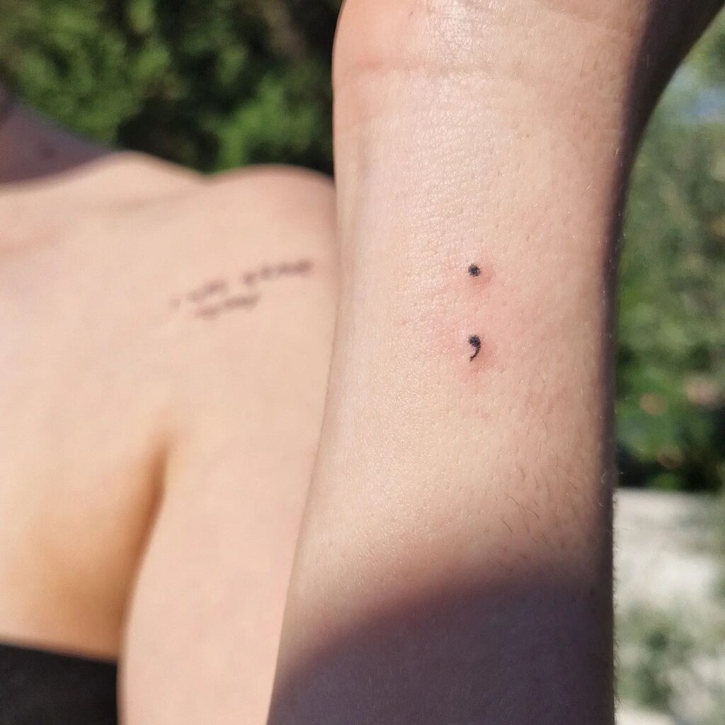 Very Tiny Semicolon Tattoo on the Side of the Wrist: Subtle Symbol