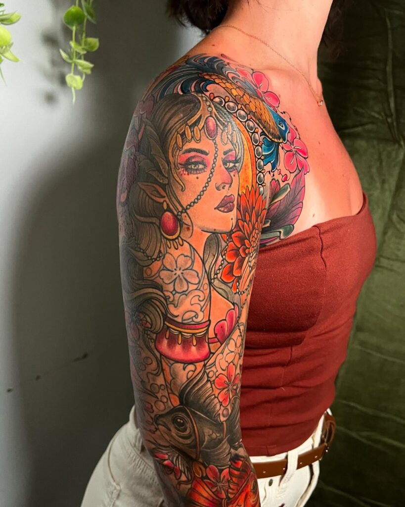 Vibrant fantasy and traditional tattoo sleeve with koi fish and floral details