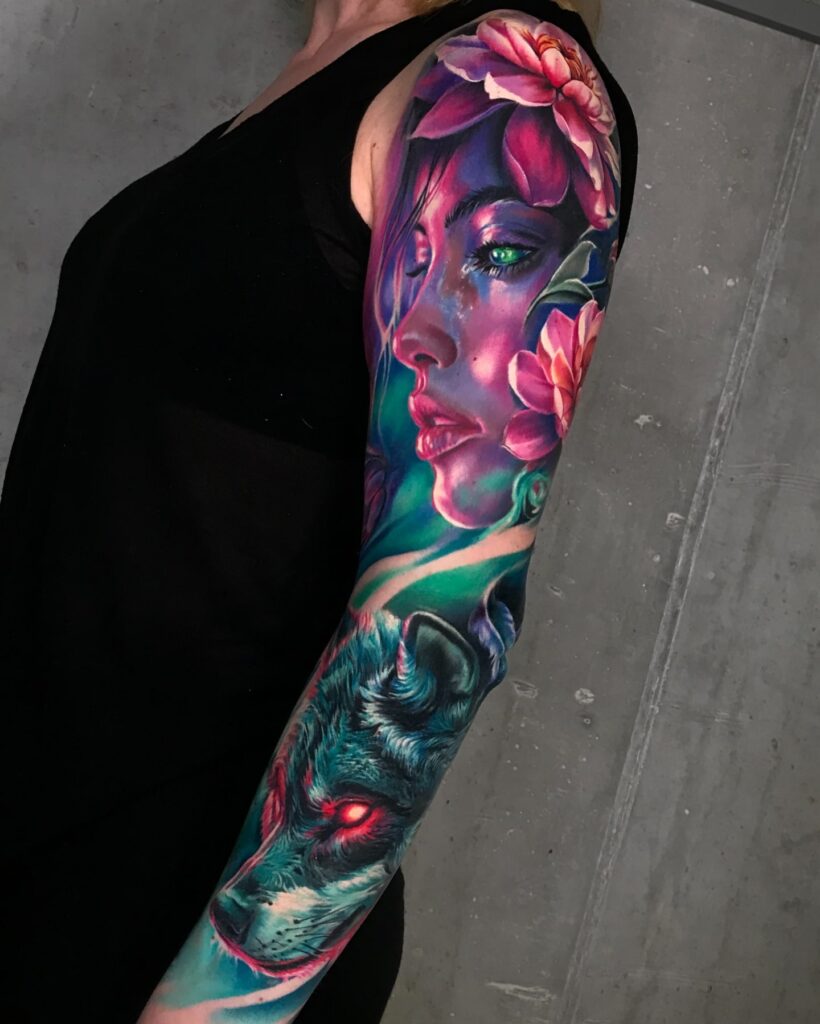Vibrant Hyper-Realistic Tattoo Sleeve with a Mystical Woman and Fierce Wolf