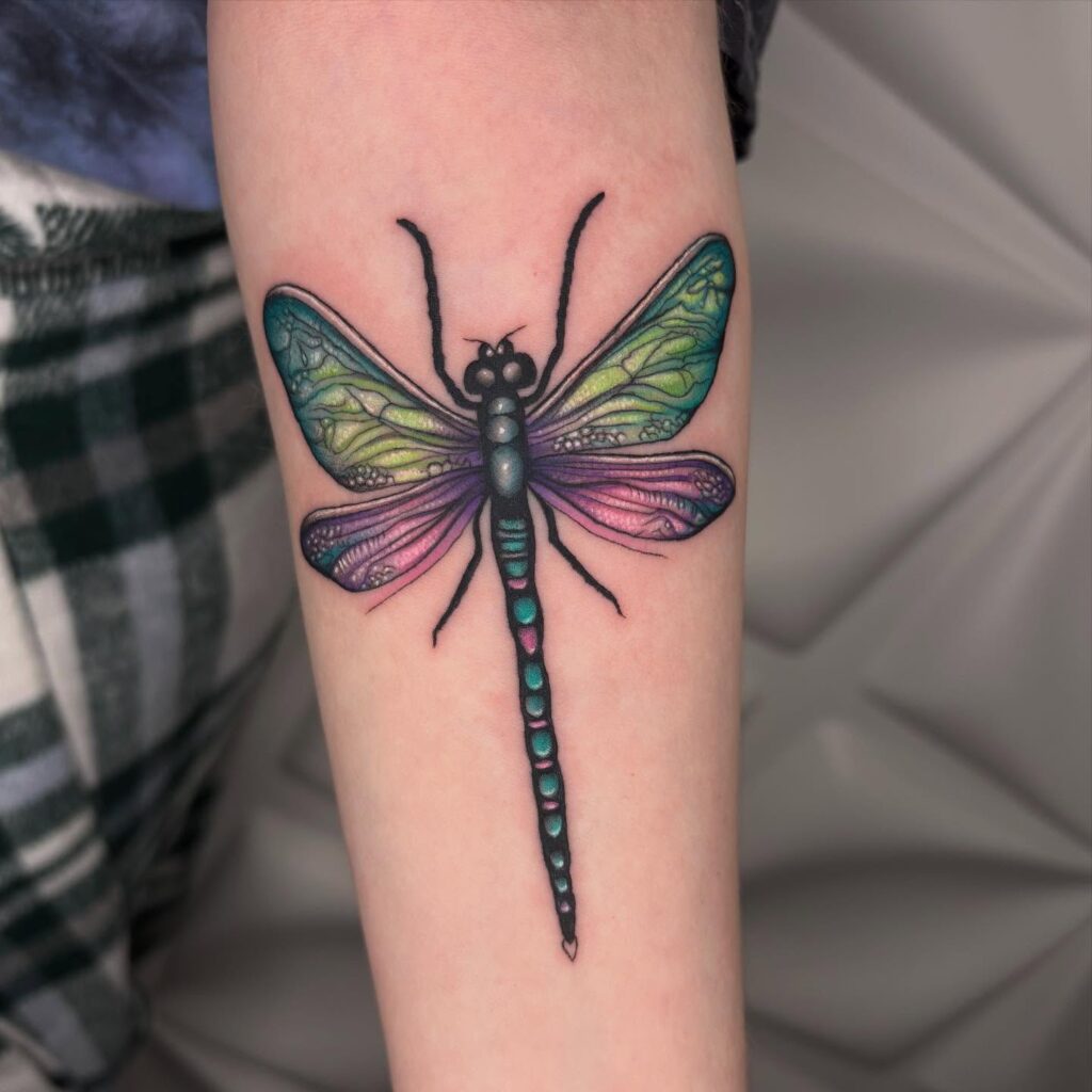 Vibrant Iridescent Dragonfly Tattoo with Colorful Shimmering Wings