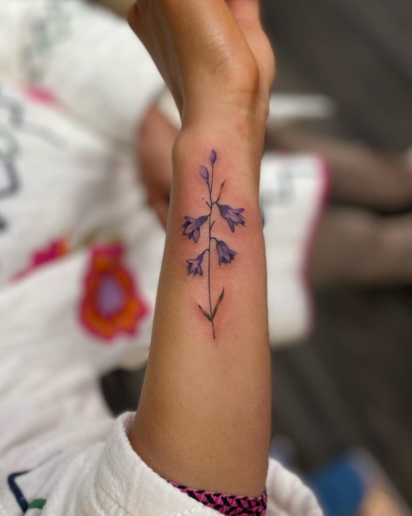 Vibrant side wrist bluebell tattoo for girls colorful floral art