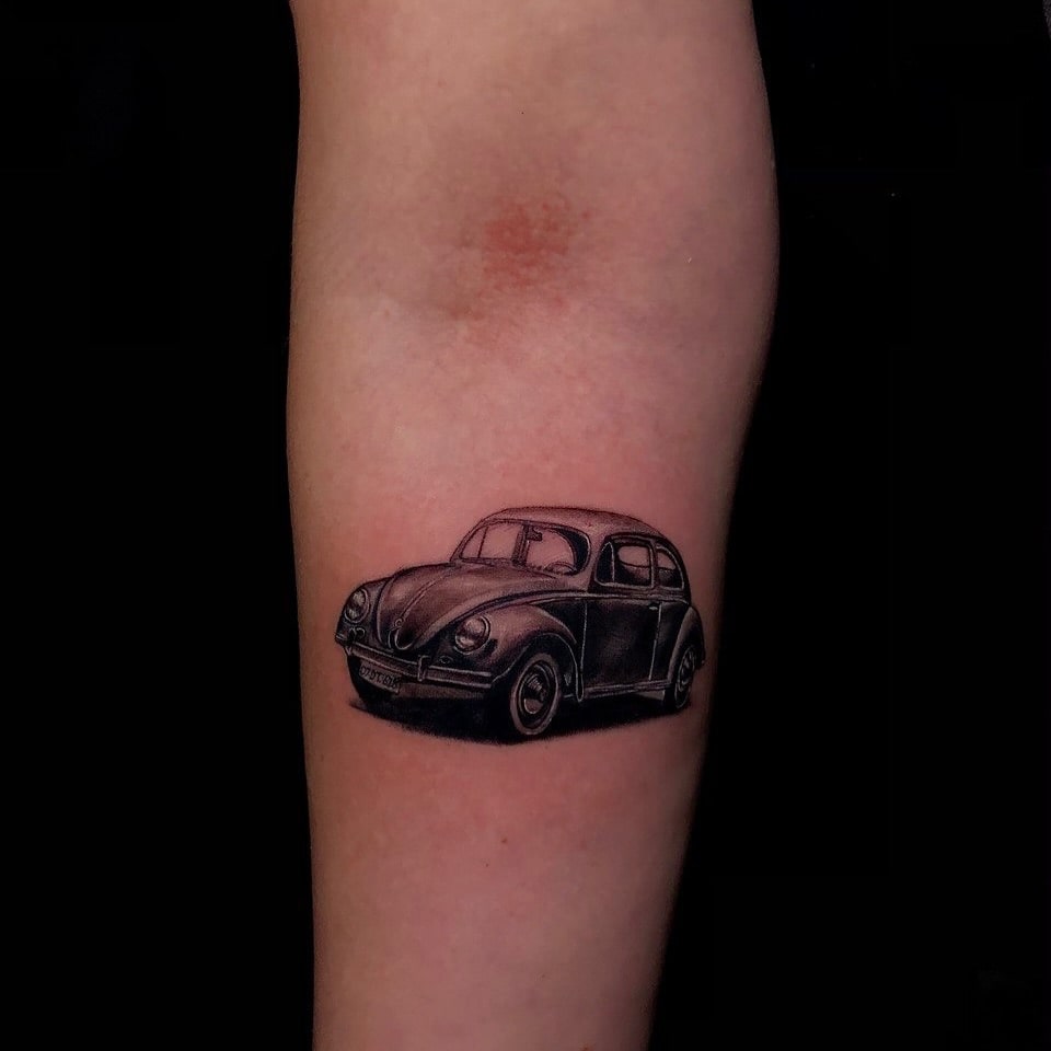 Volkswagen Beetle Tattoo with Vintage Charm and Fine Shading on Arm – Car Tattoo Ideas
