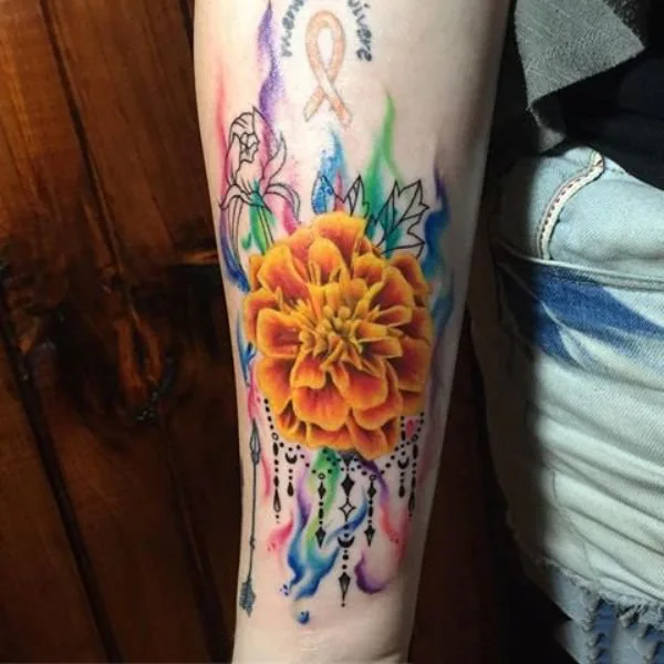Watercolor marigold tattoo