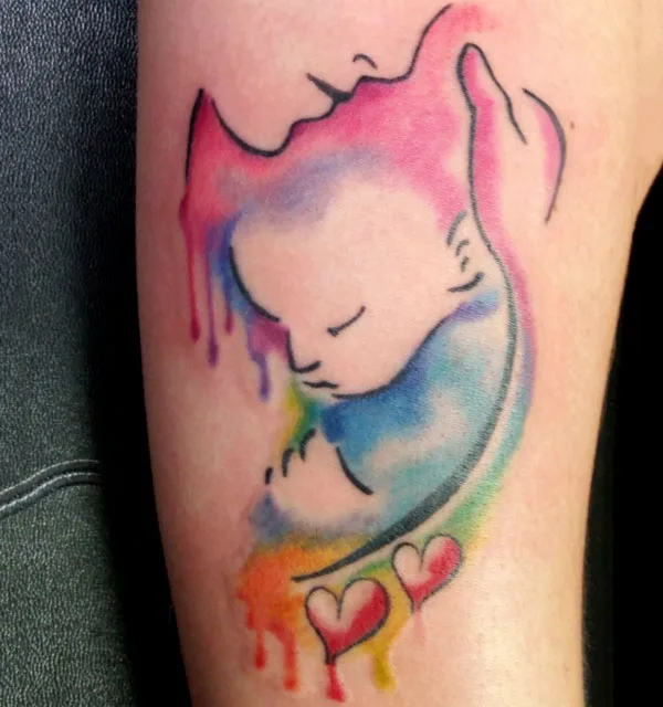 Watercolor womb tattoo