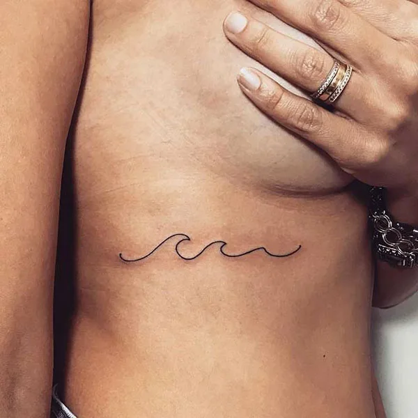 Wave tattoo under breast