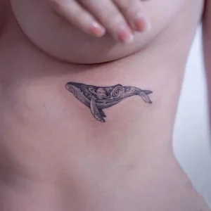 Whale under boob tattoo 1