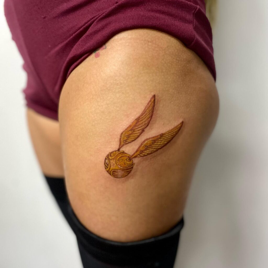 Whimsical Flight Thigh Snitch Tattoo for Women
