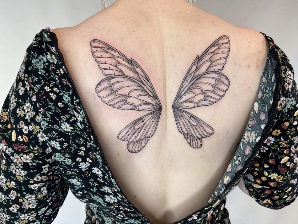 Whimsical & enchanting fairy wings tattoo on the back