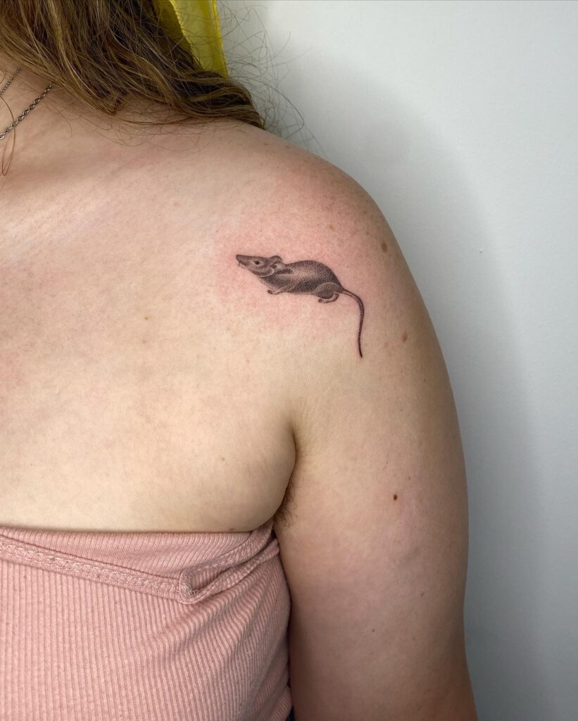 Whisker whispers tiny shaded rat tattoo on the arm and shoulder