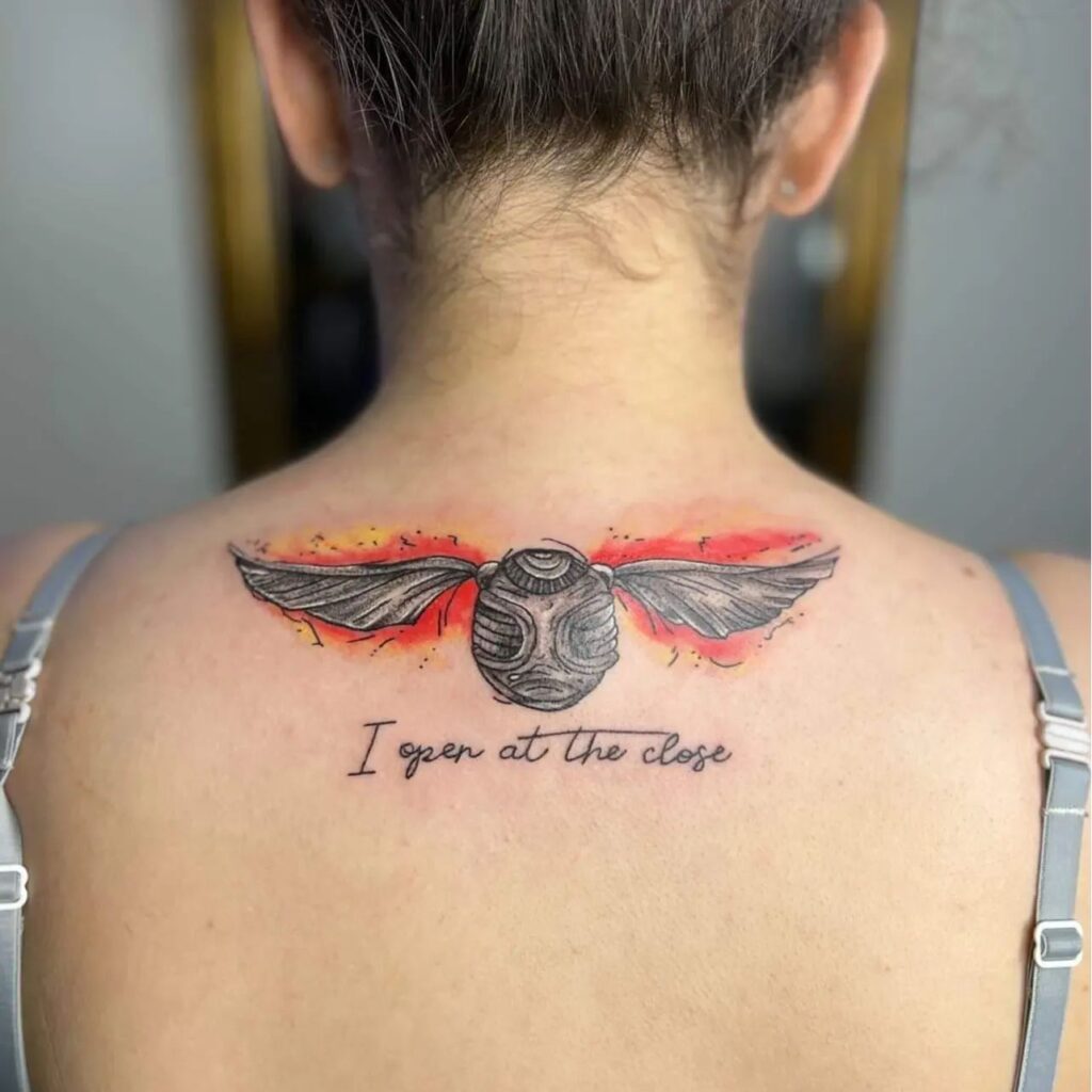 Whispering Secrets Golden Snitch Neck Tattoo With i Open at the Close Text