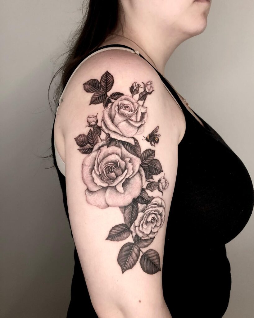 White flowers and roses with bee half sleeve upper tattoo nature's splendid bouquet