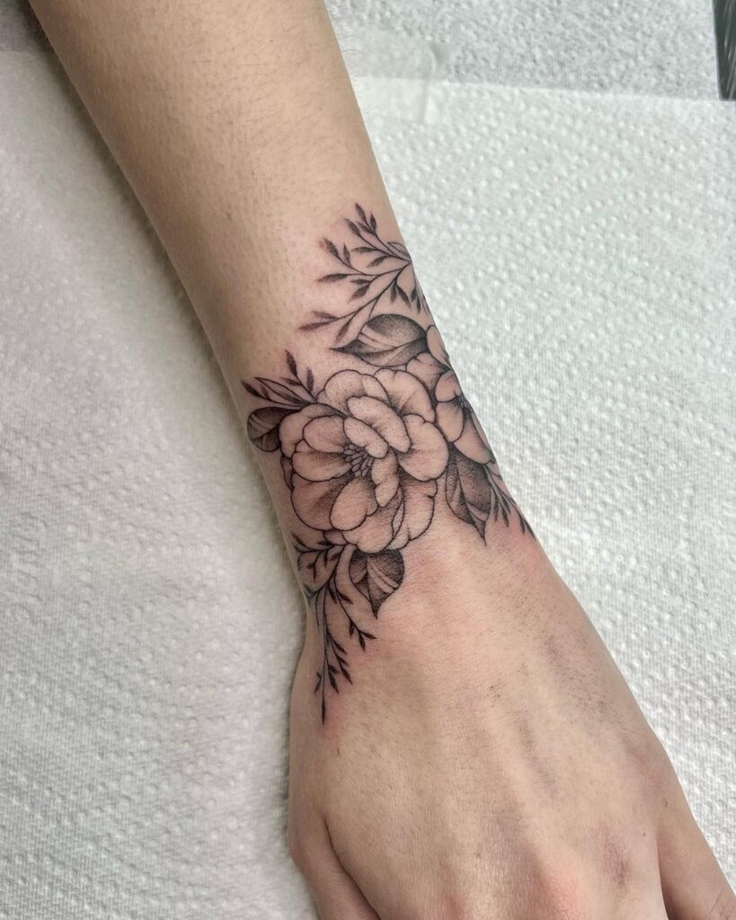 Wild floral wrist tattoo a stunning botanical design