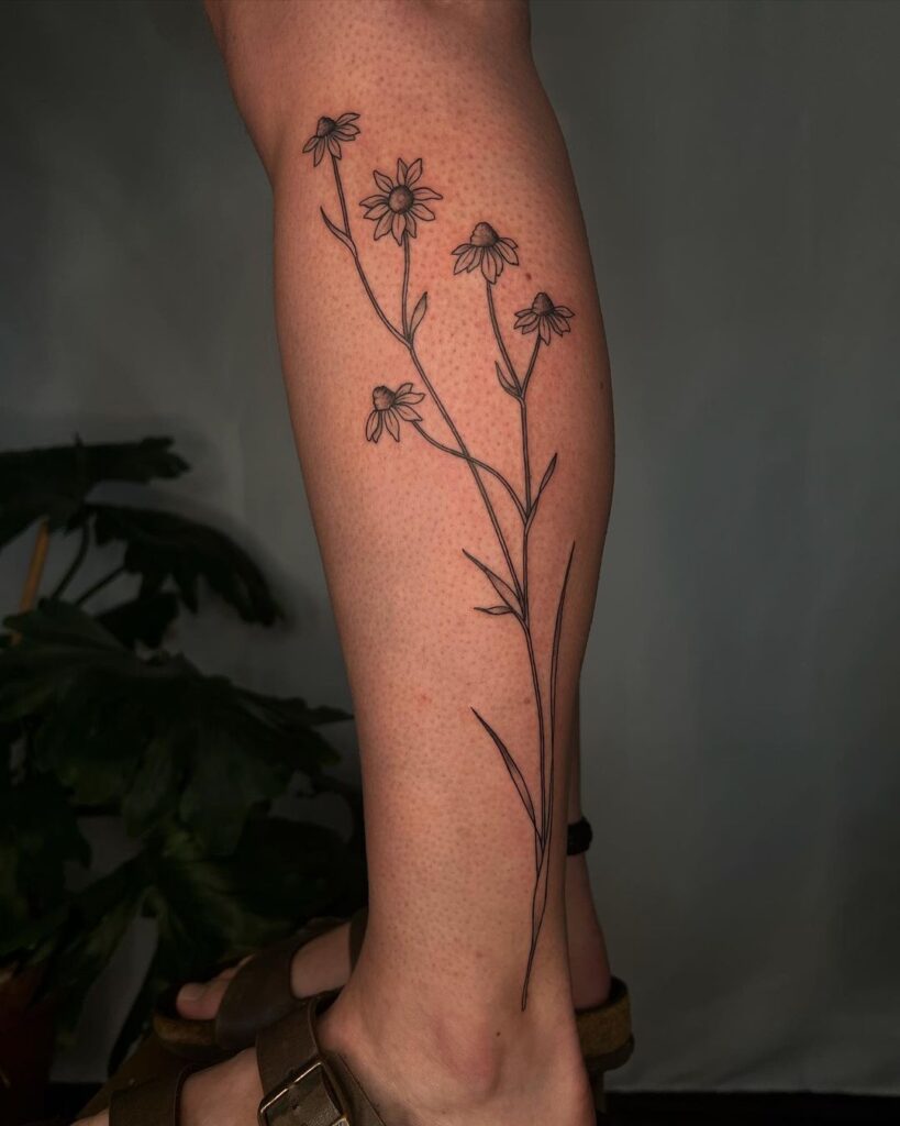 Wildflower wilderness unique calf tattoo design for women 