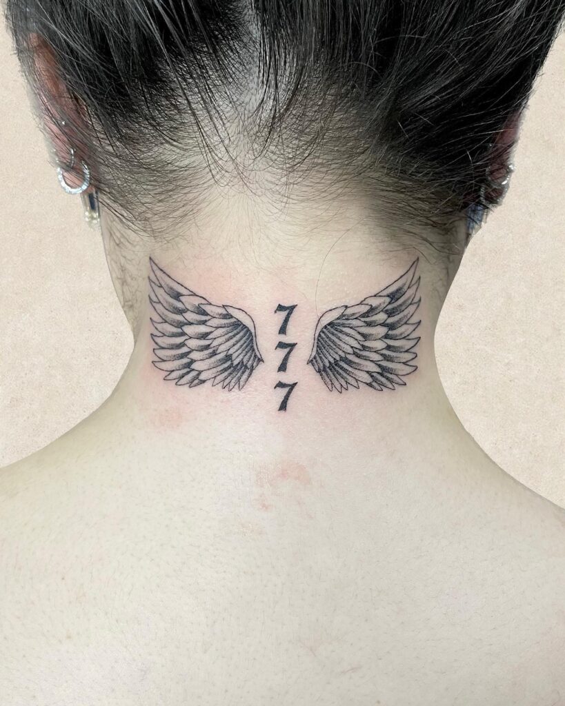 Wing Tattoo on the Back of the Neck with Vertical '777': Heavenly Trio