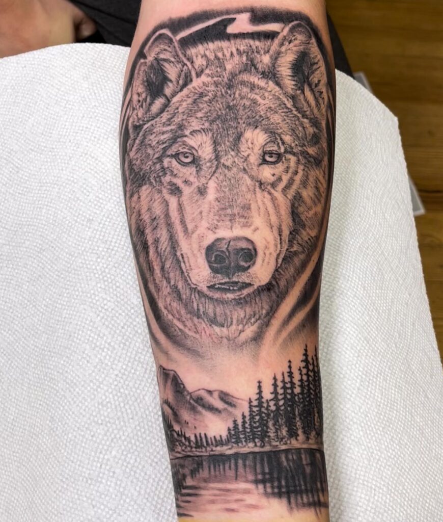 Wolf face tattoo on forearm powerful and expressive canine art