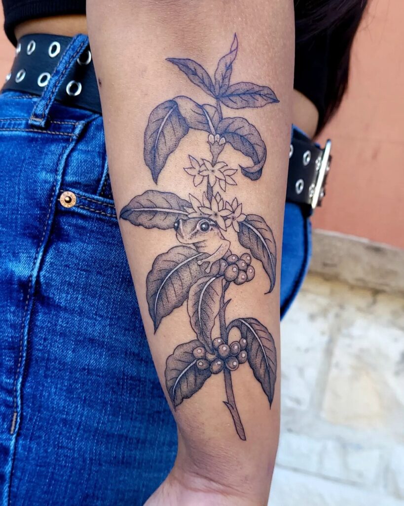 Womens coffee plant with coqui frog forearm tattoo hidden harmony