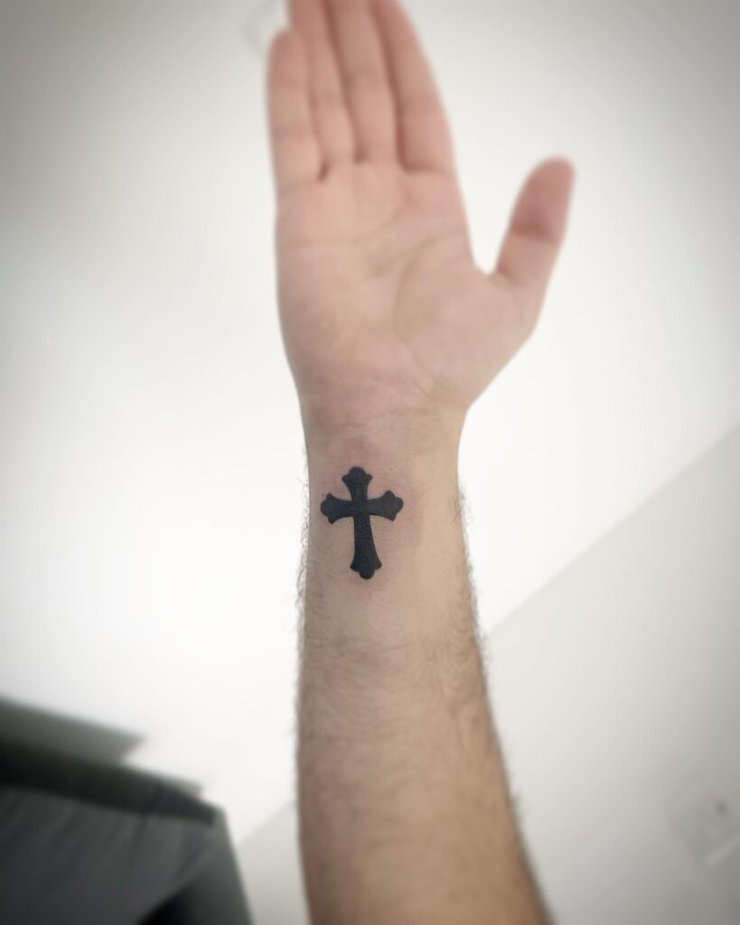Wrist affirmation tiny cross tattoo for men