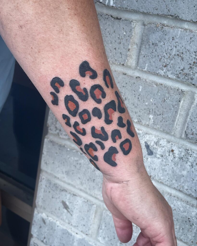 Wrist vibes vibrant leopard print tattoo