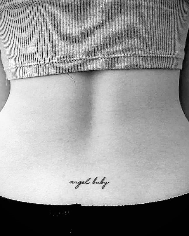 'angel Baby' Script Lettering Tattoo On The Lower Back Small Tattoo: Heavenly Sentiment