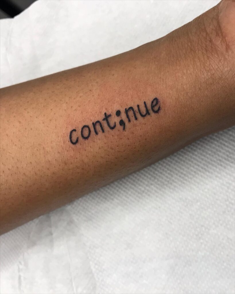'Cont;nue' Semicolon Tattoo on the Forearm: Continue Your Story