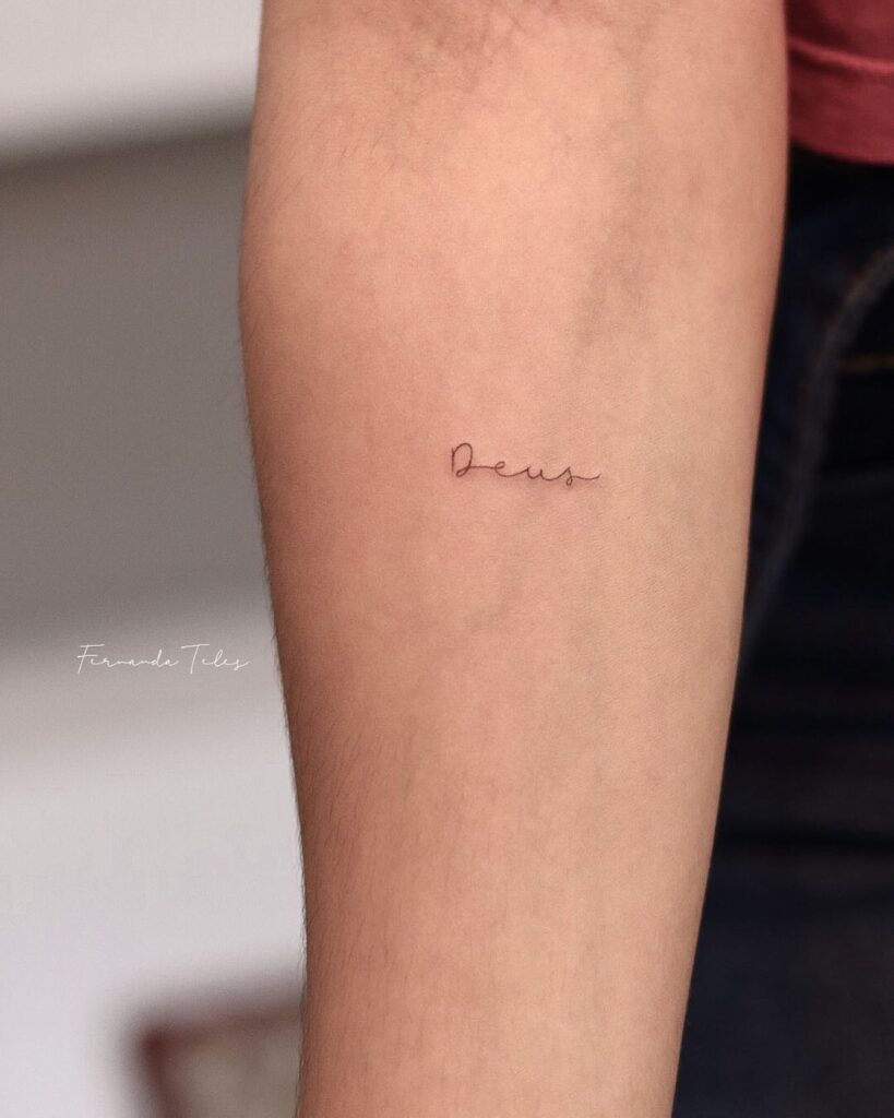 'Deus' Small Fineline Script Lettering Tattoo on the Forearm: Divine Touch