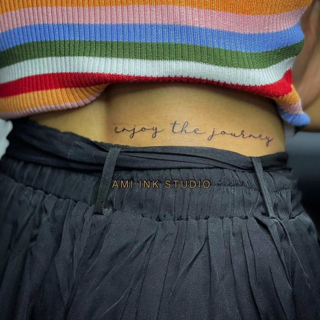 'Enjoy the Journey' Text Script Lettering Tattoo on the Side Lower Back: Journey Reverie