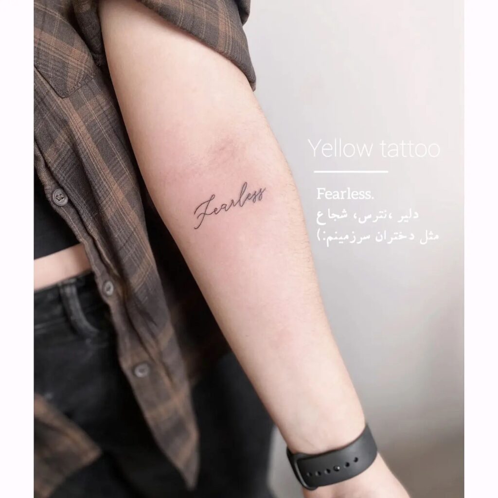 'Fearless' Fineline Script Lettering Tattoo on the Forearm: Fearless Expression