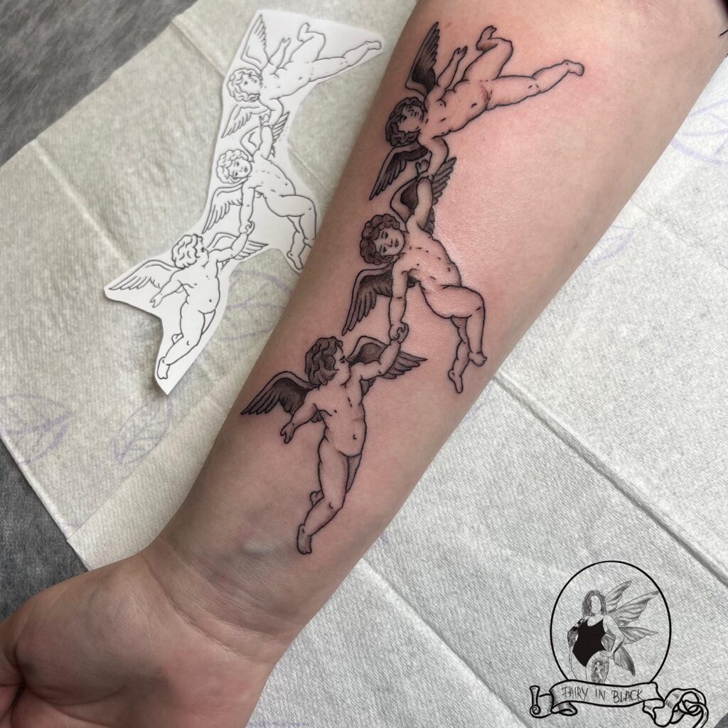 Holding Hands Baby Angels Tattoo Design for Hands
