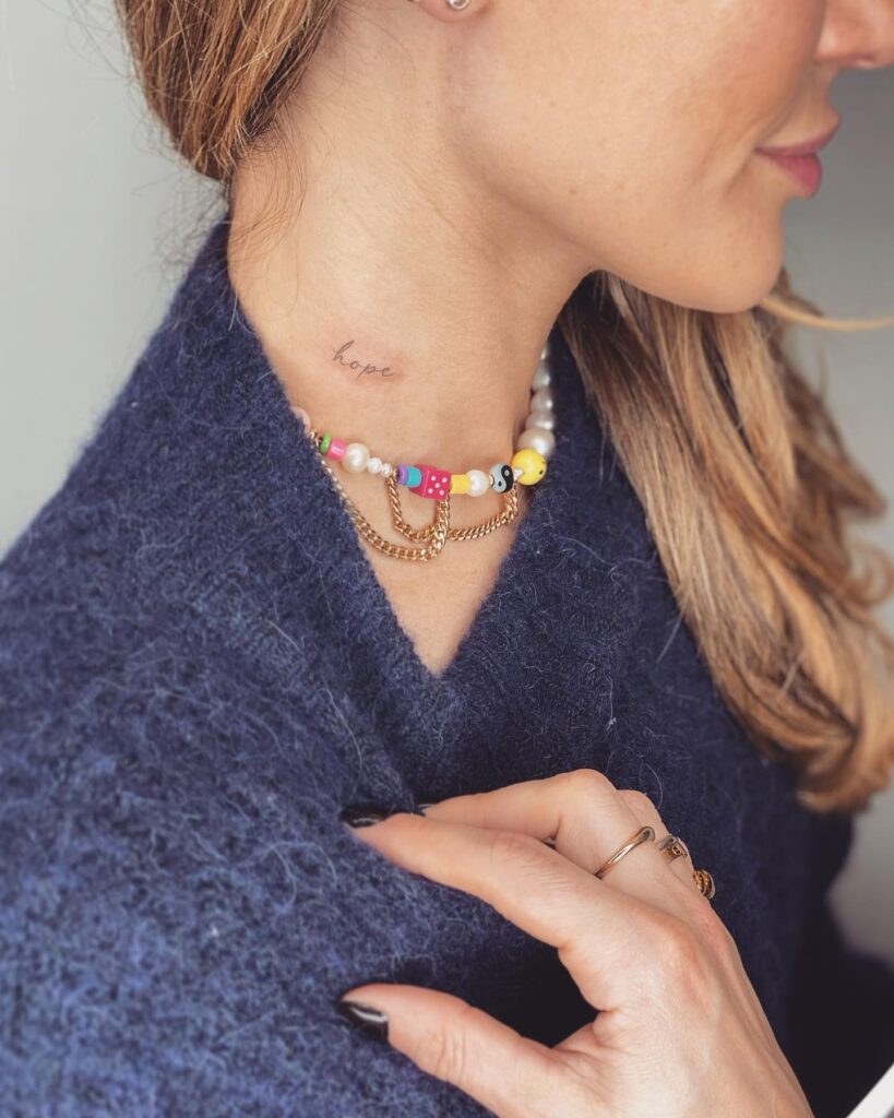 'Hope' Text Lettering Tattoo, Fineline and Small on the Side of the Neck: Whispers of Hope
