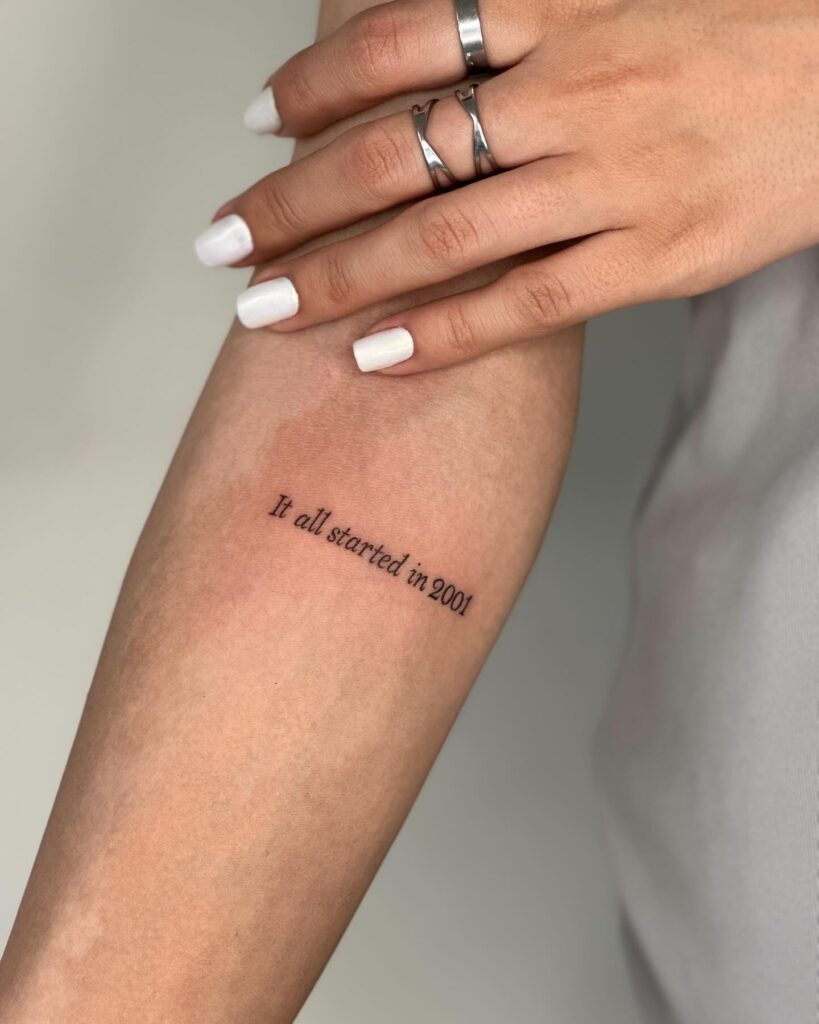 'It All Started in 2001' Text Lettering Tattoo on the Forearm: Inception Remembrance
