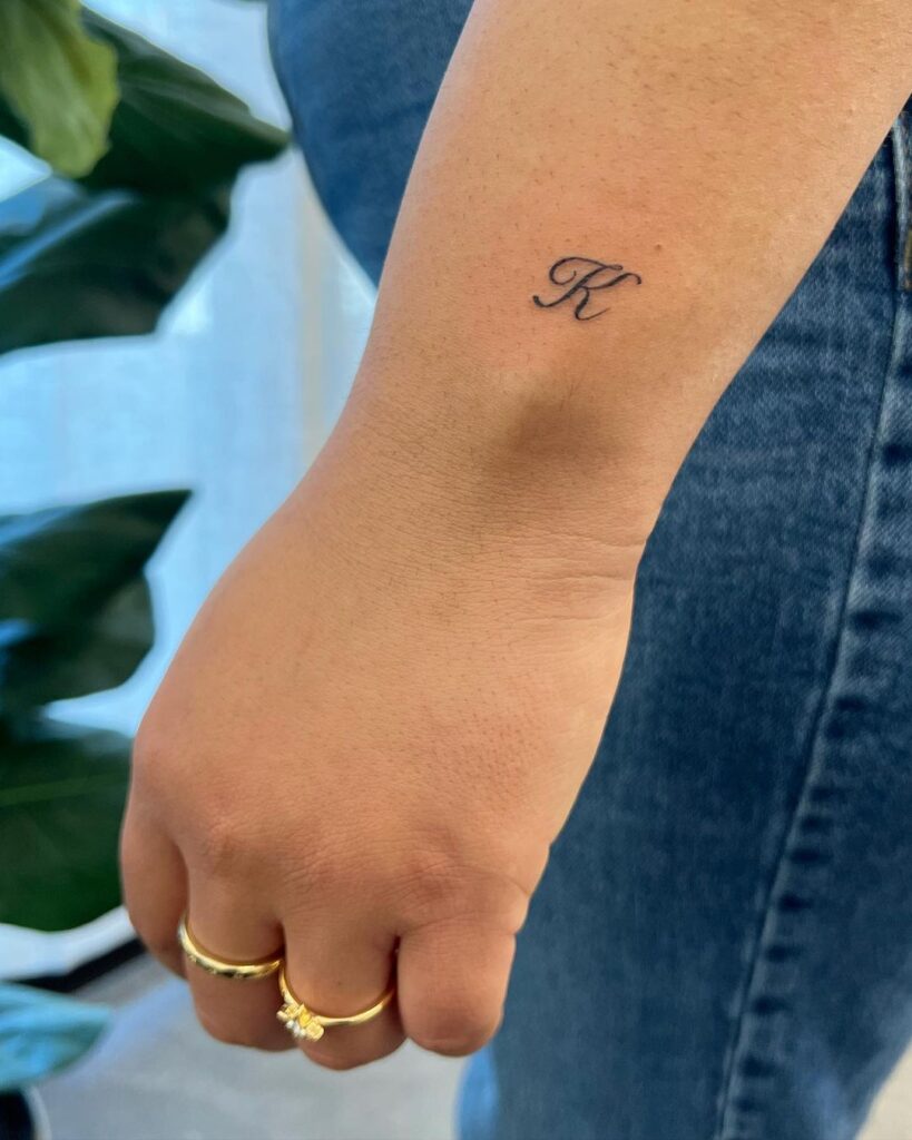 k letter outer wrist tattoo for female script lettering ink