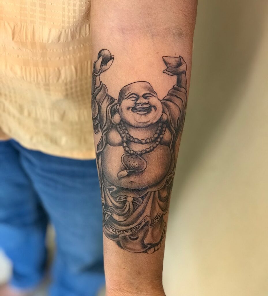laughing buddha forearm tattoo for men simple and symbolic 