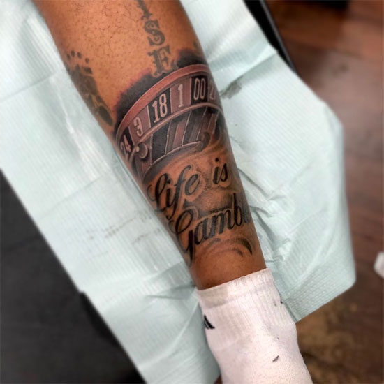 lifes a gamble tattoo on leg