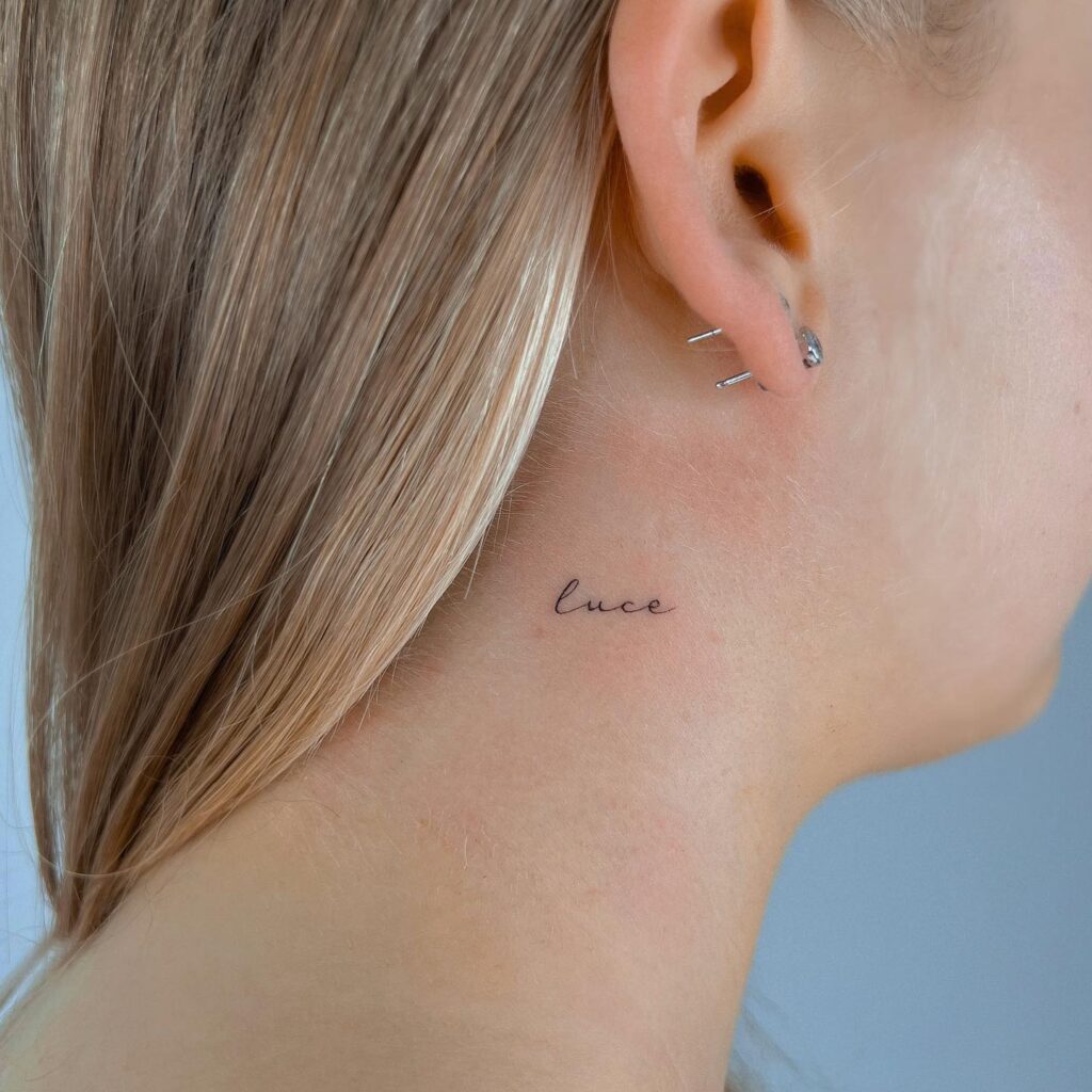 'Luce' Lettering Tattoo on the Side of the Neck, a Small Illumination: Radiant Glow