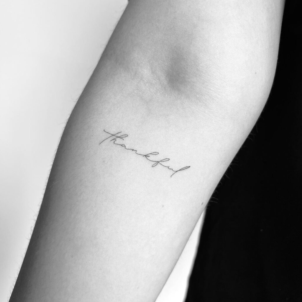 'thankful' Script Below the Elbow in Fineline: Gratitude Ink